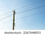 Power electric pole with line wire on colored background close up, photography consisting of power electric pole with line wire under sky, line wire in power electric pole for residential buildings