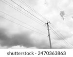 Power electric pole with line wire on light background close up, photography consisting of power electric pole with line wire under sky, line wire in power electric pole for residential buildings