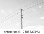 Power electric pole with line wire on dark background close up, photography consisting of power electric pole with line wire under sky, line wire in power electric pole for residential buildings