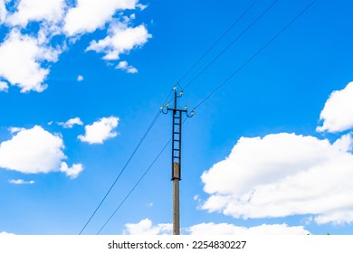 Power electric pole with line wire on colored background close up, photography consisting of power electric pole with line wire under sky, line wire in power electric pole for residential buildings - Shutterstock ID 2254830227
