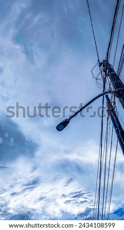Power electric pole on clear sky background