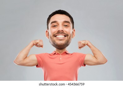 power, fitness, strength, sport and people concept - happy smiling young man showing biceps over gray background (funny cartoon style character with big head)
