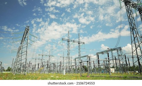 Power Grid Station. Electrical Distribution Station, Transformers, High-voltage Lines In Sunny Summer Day. Time Lapse, Timelapse, Time-lapse, 4K.