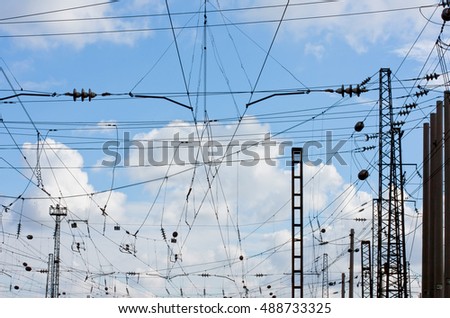 Similar – zahlreiche Schwalben sitzen auf den Freileitungen, die von einem alten Strommast ausgehen