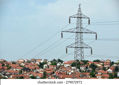 Power Line Over Houses In A Suburb Area