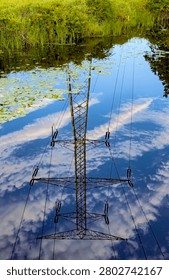 A power line tower is reflected in the waters of a DesPlaines River backwater area in DesPlaines River State Fish and Wildlife Area in Will County, Illinois