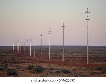 Power Lines In The Desert At Sunrise In Australia