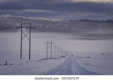 Power Lines Lining Desolate Winter Road in Rural Idaho