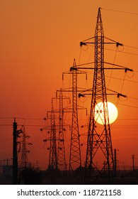 Power Lines Poles Over Setting Sun