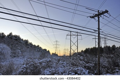 Power Lines Running Through Snow Field