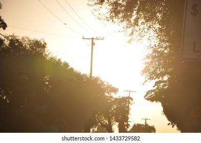 Power Lines And Sunlight In California