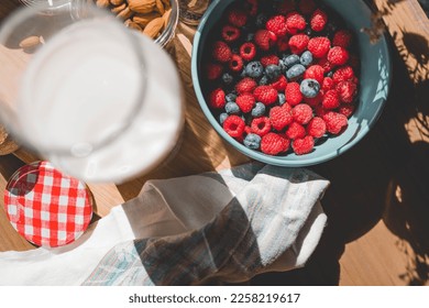 The power of nourishment: A beautiful display of ingredients, including fresh fruits, nuts, and milk, sets the stage for a delicious and healthy meal - Shutterstock ID 2258219617
