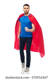 power and people concept - man in red superhero cape over white