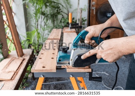 Power planer timber manipulation equipment motor carpentry woodcraft construction workshop renovation craftsmanship maintenance production precision mechanic project apparatus