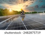 A power plant engineer installs solar panels To inspect the solar panels, engineers use tablets Technology for renewable energy and sustainability Future sources of alternative energy