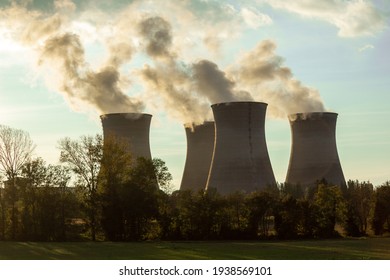 Power Plant with smoke and sunset light shinning