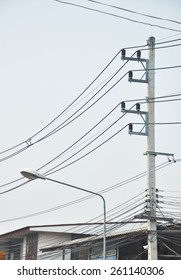 Power Poles And Telephone Towers Near The House.