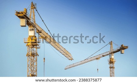 Power and precision of construction Cranes in modern infrastructure. Building construction, autumn season