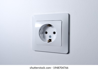 Power Socket On The Empty White Wall