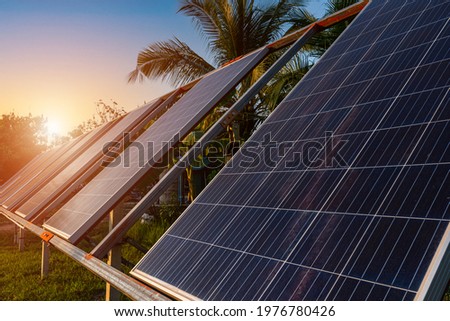 power solar panel for agriculture in a rural houses area Agricultural fields blue sky background,Agro-industry of household Rural style in Thailand, smart farm alternative clean green energy concept 商業照片 © 