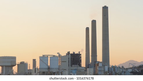 Power station in Hong Kong city at sunset  - Shutterstock ID 1016376178