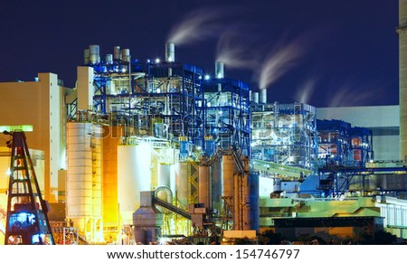 power station at night with smoke 