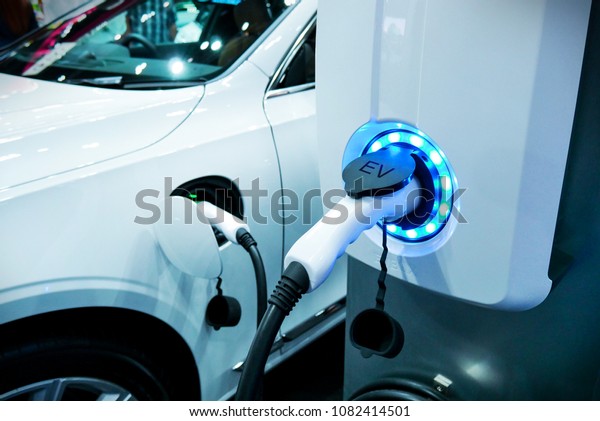 Power supply\
connect to electric vehicle for charge to the battery. Charging\
technology industry transport which are the futuristic of the\
Automobile. EV fuel Plug in hybrid\
car.