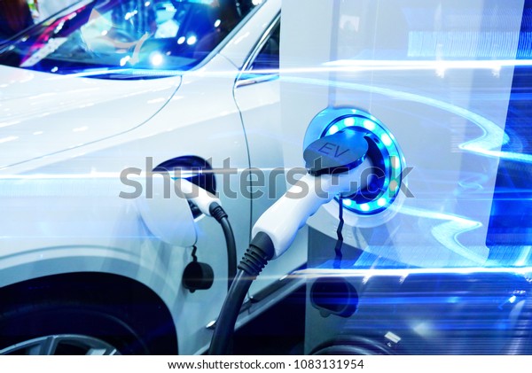 Power supply\
connect to electric vehicle for charge to the battery. Charging\
technology industry transport which are the futuristic of the\
Automobile. EV fuel Plug in hybrid\
car.