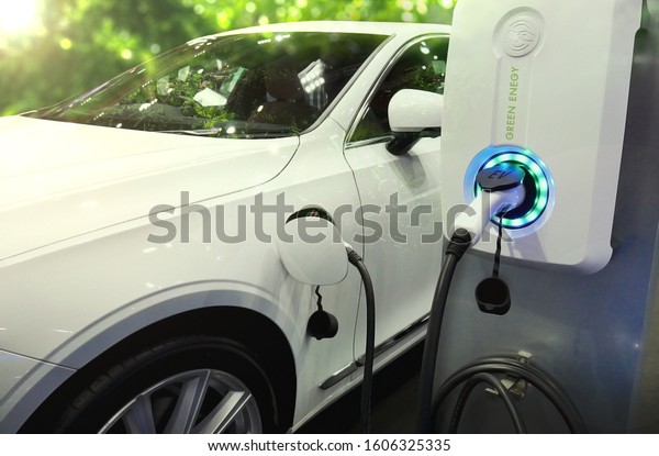 Power supply
connect to electric vehicle or EV car for charge to the battery.
Charging technology industry transport in Eco-friendly alternative
energy concept to green
energy.