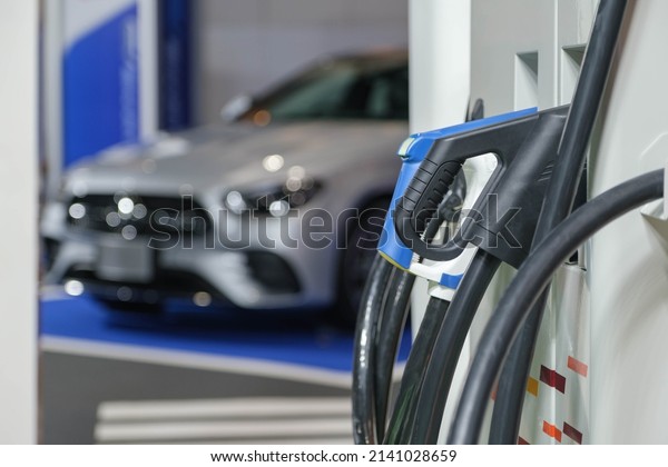 The power supply connects to electric vehicles to\
charge batteries, charging industrial transport technology, which\
is the future of EV vehicles. Fuel is plugged into a hybrid\
vehicle. at the launch e
