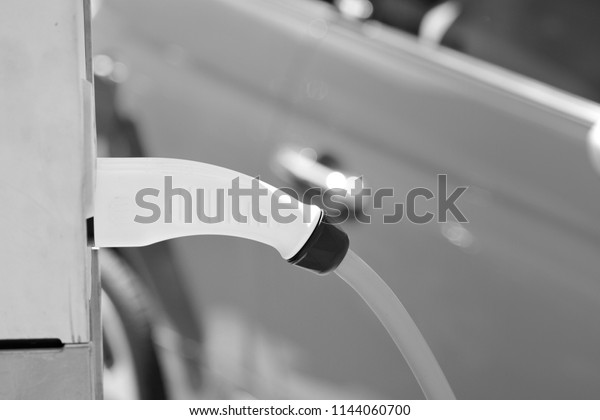 Power supply for electric car charging.\
Electric car charging station. Black and\
white.