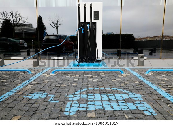 Power supply for electric car charging. Electric\
car charging station. electric car charging station icons\
indicating private parking\
space