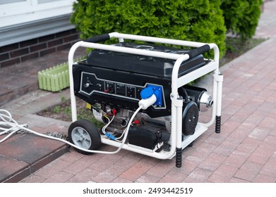 Power supply generator placed on street sidewalk. outdoor diesel power generator in Ukraine.