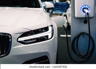 Power supply for hybrid electric car charging battery. Eco car concept. - Shutterstock ID 1165397335