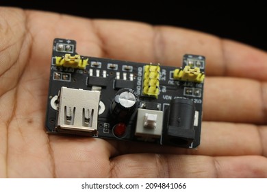 Power supply module for breadboard with usb and dc pin slot held in hand