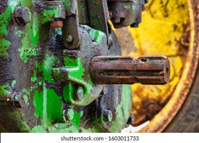 The Power Take-off Or PTO Shaft On An Old Greasy Farming Tractor