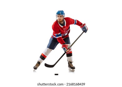 Power throw. Young male hockey player in sports uniform training isolated on white background. Sportsman wearing equipment and helmet skating. Concept of sport, motion, movement, action, ad