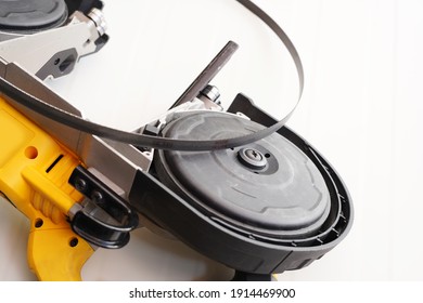 Power Tool .Deep Cut And Compact Band Saws,cordless Band Saws,Portable Band Saw On White Background ,selective Focus On Band Saw Blade