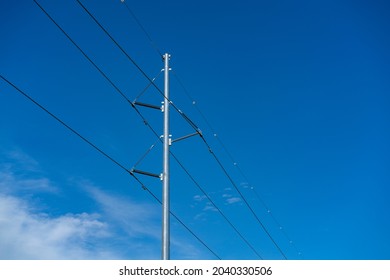 Power Transmission Line Against Blue Sky Background 