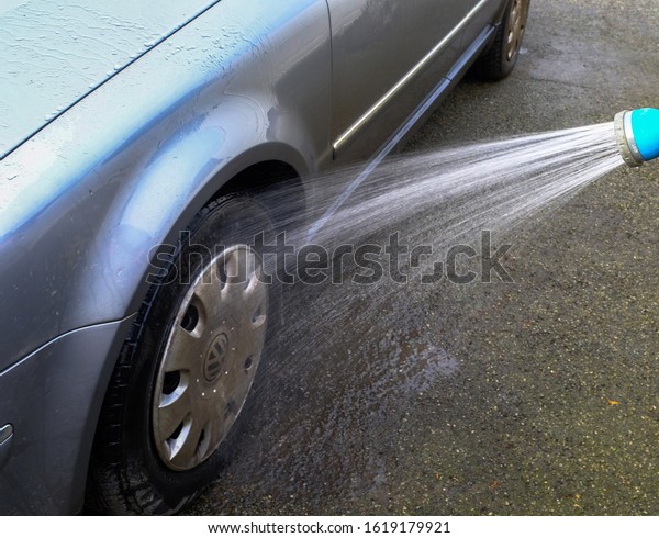 Power washing car with VW wheel trims. North Wales, UK,
5th January 2020. 