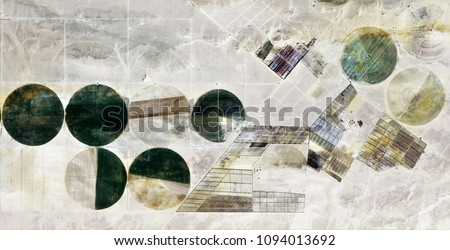 The power of the wind, farms of human crops in the desert, abstract photography of the deserts of Africa from the air, Genre: Abstract Naturalism, from the abstract to the figurative,