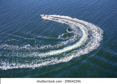 Powerboat and his trace on the blue sea
