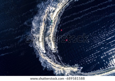 Similar – Aerial view of small boat in sea