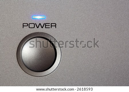 Powerbutton - close-up. Copyspace on grey/silver front.