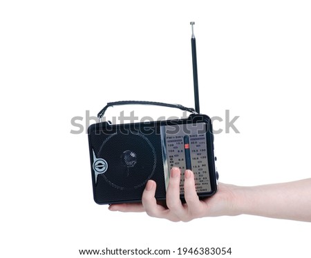 powered radio in hand on white background isolation
