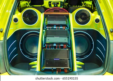 A Powerful Audio System With Amplifiers Speakers And Lcd Monitors In The Car Trunk.