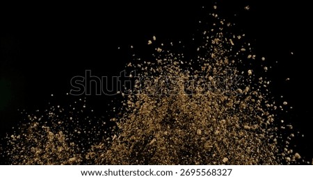 Powerful burst of clay particles exploding upward in a dense cloud, isolated on black. High-speed photography capturing the dynamic texture of dry earth in motion.