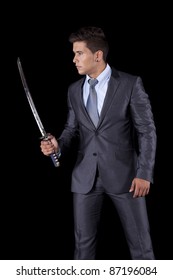 Powerful businessman holding a ninja sword (isolated on white)