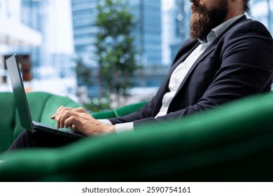 Powerful CEO sets his work environment for maximum productivity, showcasing business leadership in a modern office. Young leader manages a corporate enterprise, enhance efficiency.