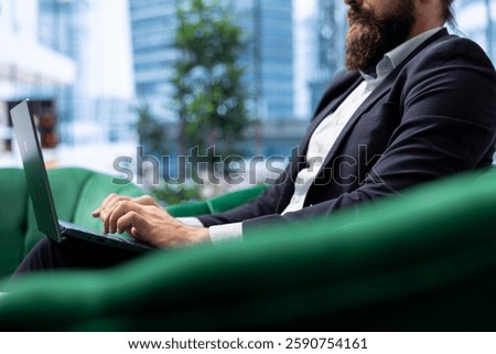 Powerful CEO sets his work environment for maximum productivity, showcasing business leadership in a modern office. Young leader manages a corporate enterprise, enhance efficiency.